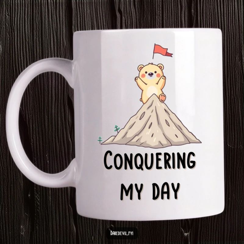 Funny bear mug showing a whimsical bear triumphantly planting a flag on a tiny mountain peak, celebrating a grand achievement.