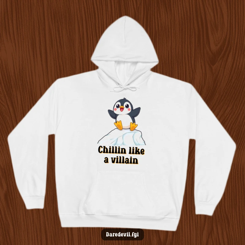 Funny hoodie illustration of a surprised penguin expertly sliding down an icy ramp, perfect for cozying up.