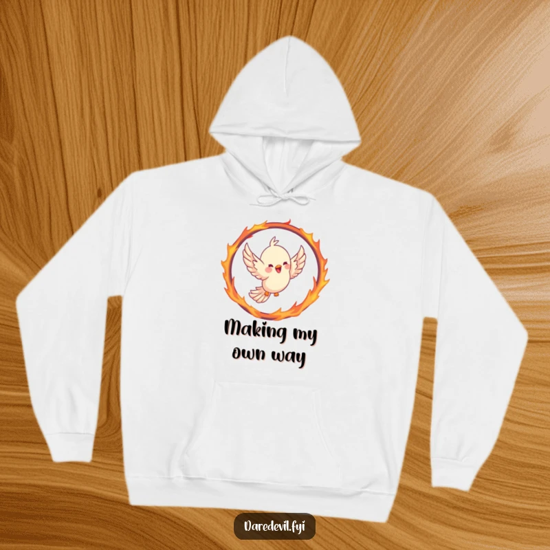 Funny bird hoodie showing a joyful bird soaring through a hoop shaped like a fiery ring, wings outstretched in a triumphant flight.