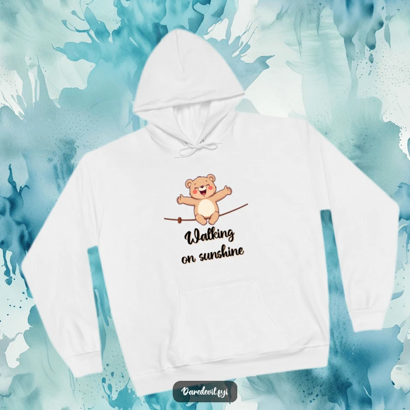 Funny bear hoodie showing a giggling bear balancing on a tightrope, perfect cozy and humorous apparel.