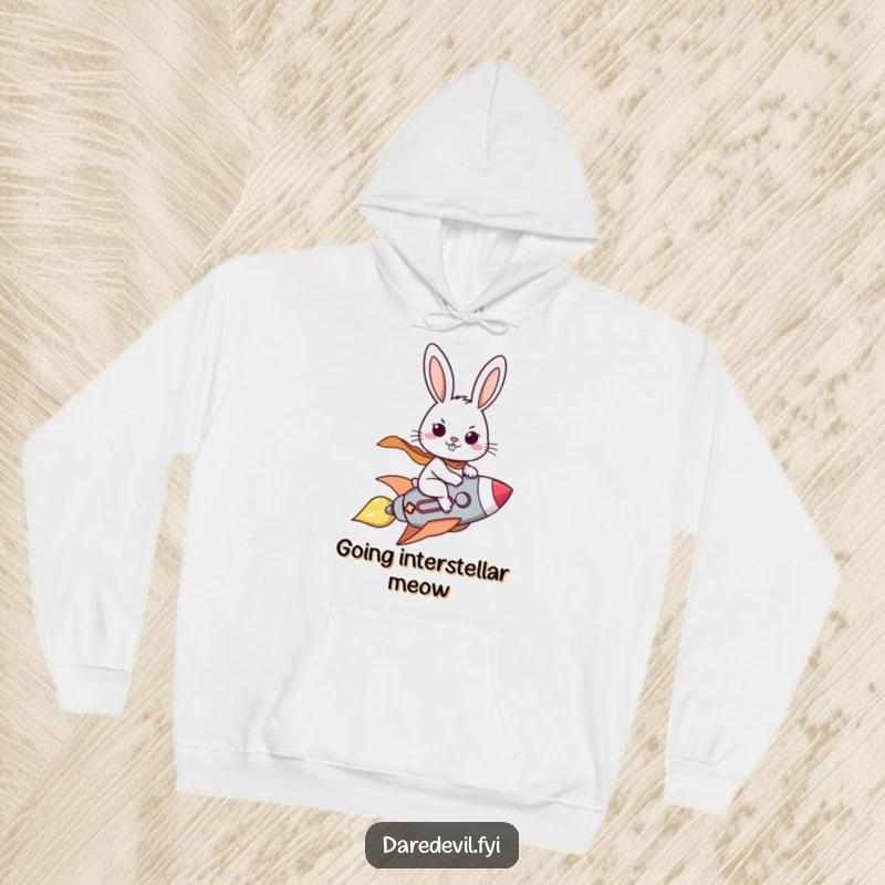 Funny hoodie featuring a brave rabbit character determinedly piloting a small rocket with a confident and adventurous grin.
