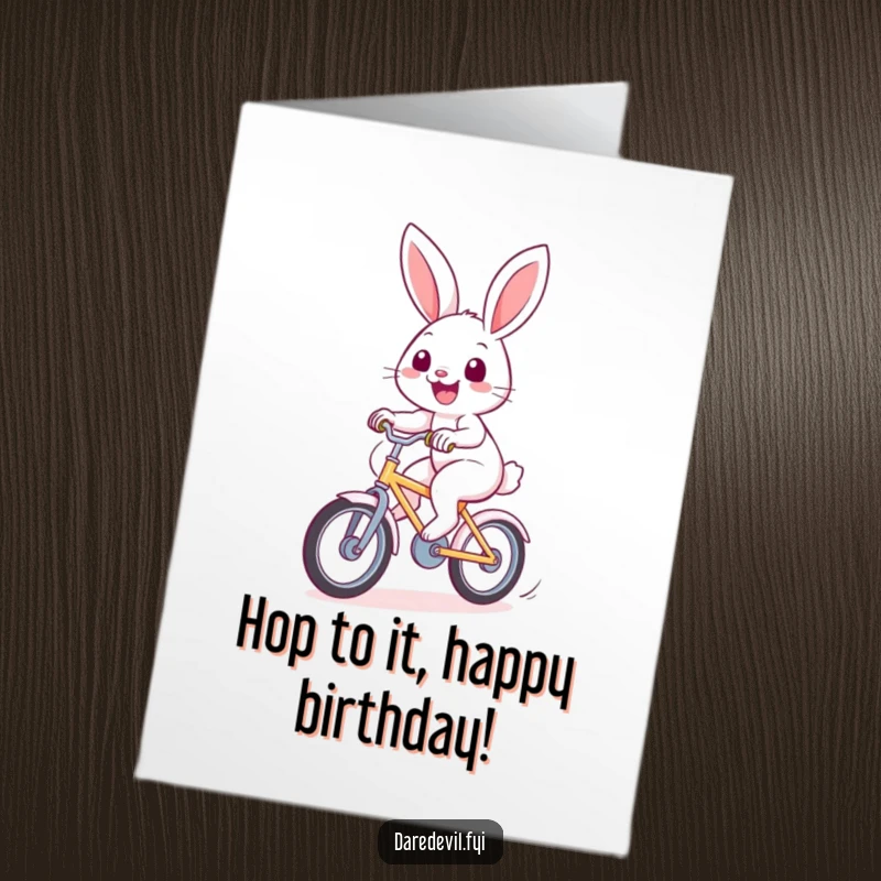 Funny Free Printable Birthday Card: A cheerful rabbit speeds by on a bicycle with a huge smile, wishing a happy birthday.