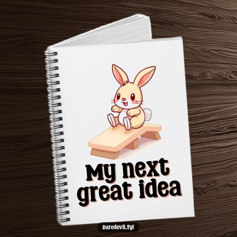 Funny bunny sliding down a miniature ramp, depicted on the cover of a notebook, inspiring humorous writing and note-taking.
